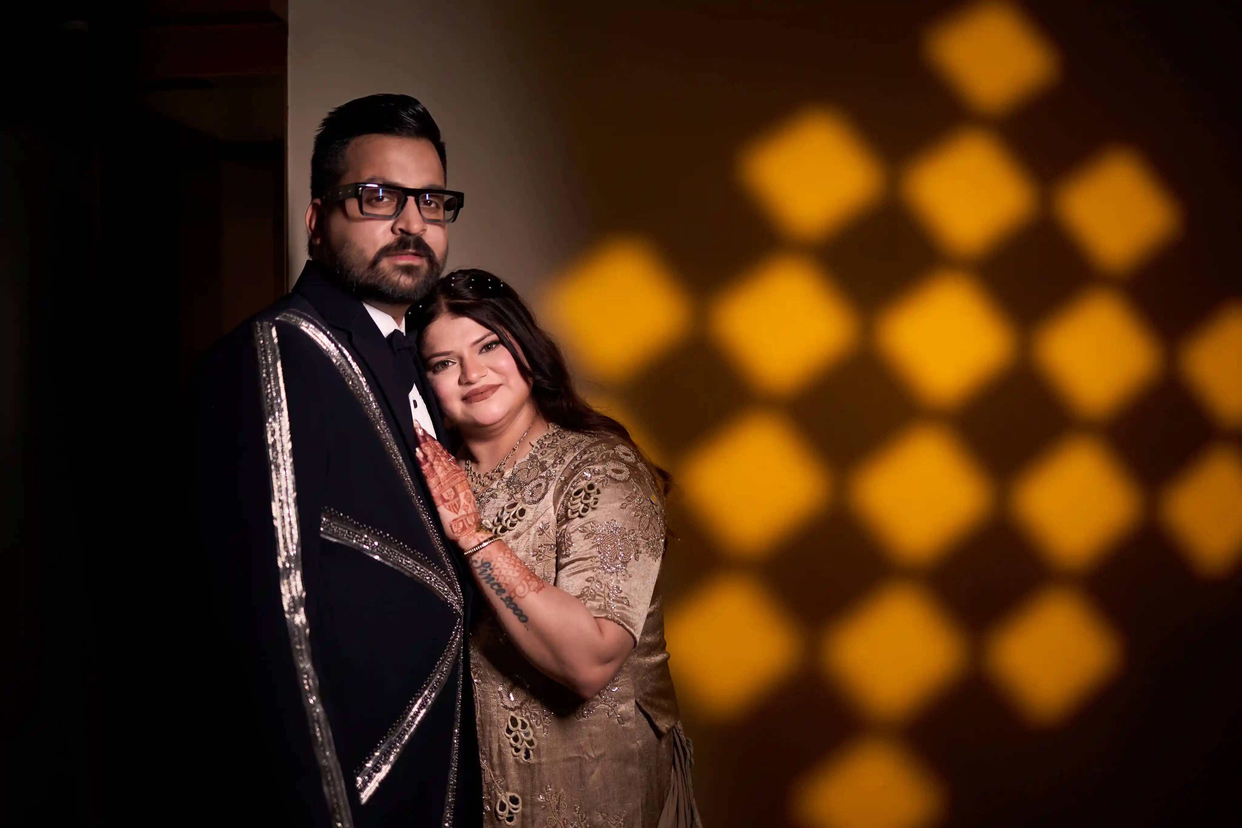 Cinematic engagement couple portrait in golden gobo light at Heritage Palace Varanasi by The WeddingShoot